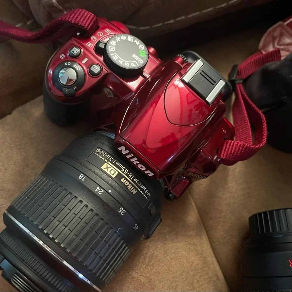 Nikon D3100 new camera has 2 batteries charger extra lens and carrying case